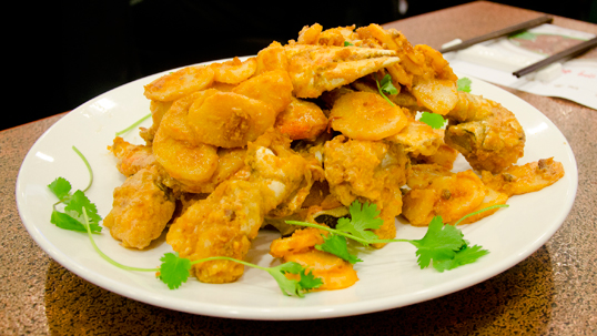 Stir-Fried Dungeness Crab with Egg Yolk Sauce & Rice Cake from Big Chef Restaurant. Photo courtesy of Chinese Restaurant Awards  
