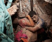 Two victims amid the rubble of the Rana Plaza factory in Dhaka, Bangladesh. | Photo courtesy of Times Asi  