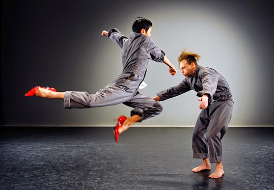 Dancers Ziyian Kwan and James Gnam perform “a slow awkward” on stage at Dancing on the Edge. | Photo by Chris Randle.  