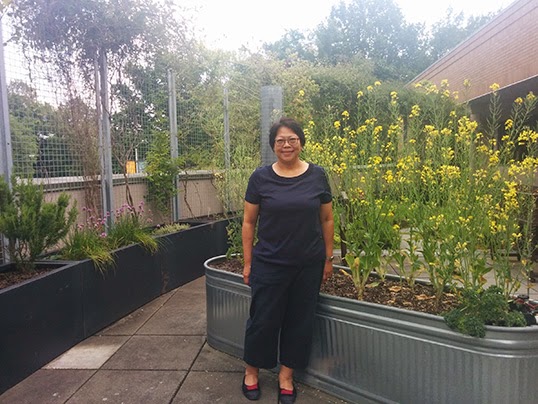 Geok Bin Phua, recipient of the Richmond Arts Award in Volunteerism, in the garden on the rooftop of the Richmond Public Library. | Photo by Naomi Tse  