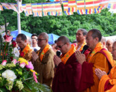 Monks praying before Buddha bathing. | Photo courtesy of Buddhist Vihara Society in BC