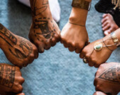 Showing off their tattoos for Body Language: Reawakening Cultural Tattooing of the Northwest.| Photo courtesy of Bill Reid Gallery of Northwest Coast Art.  