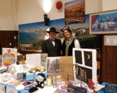 Alik Schlastlivenko, with a representative from Azerbaijan and Tatarstan, stands at a booth in last year’s friendship festival.   