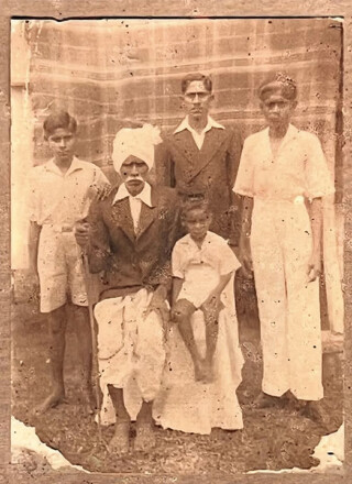 Image of Chiraungi Singh (date unknown) pictured with four children. — Photo courtesy of Sandhya Prasad and Jyotika Singh