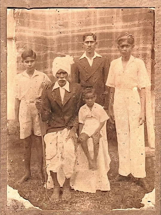 Image of Chiraungi Singh (date unknown) pictured with four children. — Photo courtesy of Sandhya Prasad and Jyotika Singh