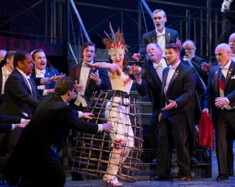 Justin Welsh as Marullo, Jan van der Hooft as Matteo Borsa, and Andrew Greenwood as Count Ceprano with the Pacific Opera Victoria Chorus and Supernumaries | Photo by David Cooper Photography  