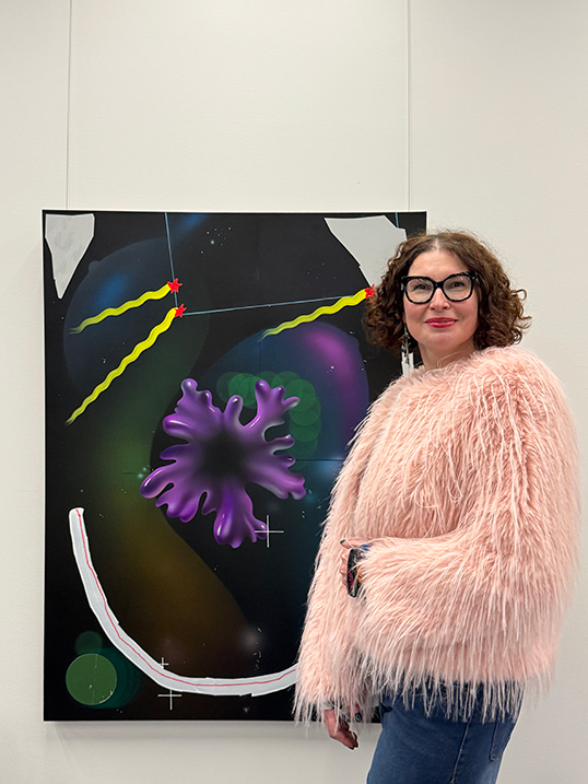 Sofiya Mukhachova with her artwork.| Photo courtesy of Sofiya Mukhachova.   