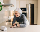 A senior uses “smart home” technology.  