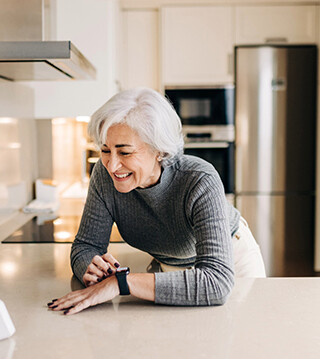 A senior uses “smart home” technology.  