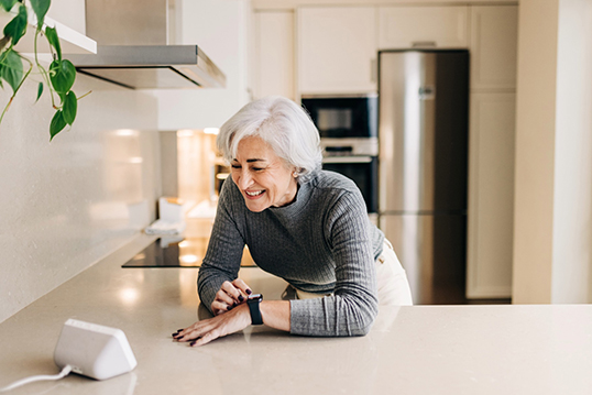 A senior uses “smart home” technology.  
