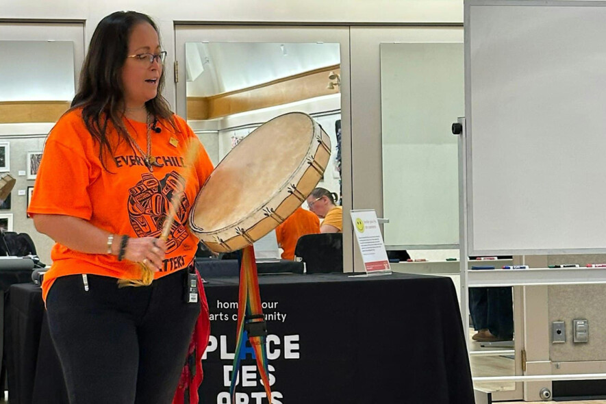 Christine Mackenzie leads the workshop with a traditional hide drum. &mdash; Photo courtesy of Place des Arts