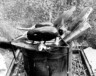 Cooking on a makeshift stove, photo from Pizza Before We Die (Arsenal Pulp Press, 2026). | Photo by Hassan Kanafani.    